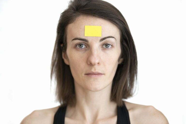 Close-up of frown lines between the eyebrows before Botox for 11 lines
