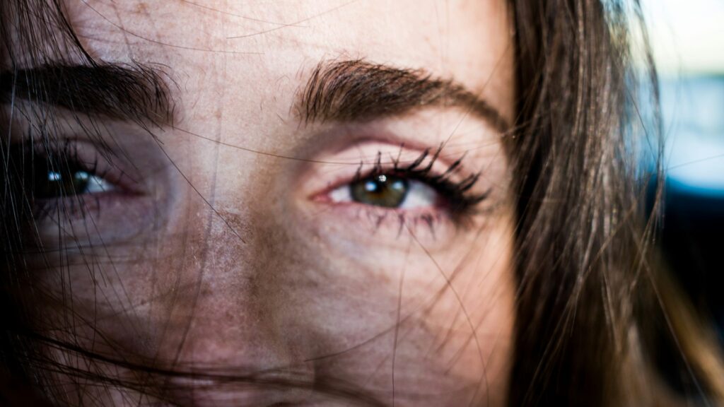 Woman raising her brows, showing expression lines that respond to Botox | LightTouch Med Spa Woman raising her brows, showing expression lines that respond to Botox