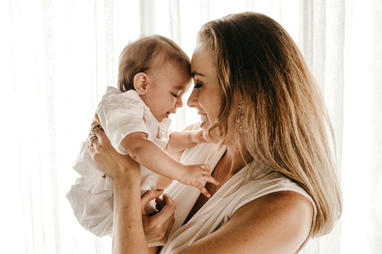 New mother holding her baby at home, wondering about Botox while breastfeeding