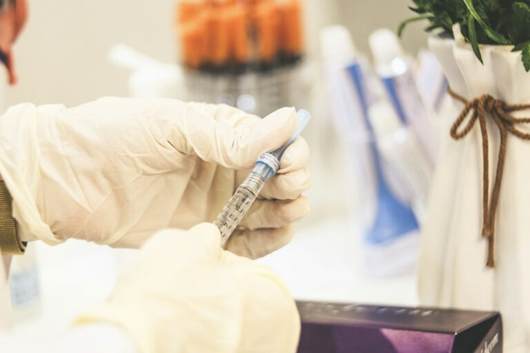 Injector examining a patient's face before treatment, considering the riskiest p | LightTouch Med Spa Injector examining a patient's face before treatment, considering the riskiest places for filler